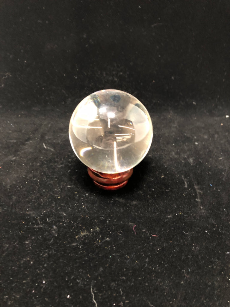 CLEAR GLASS ORB ON STAND.