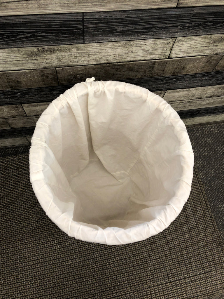 LINED WICKER LAUNDRY HAMPER BASKET.