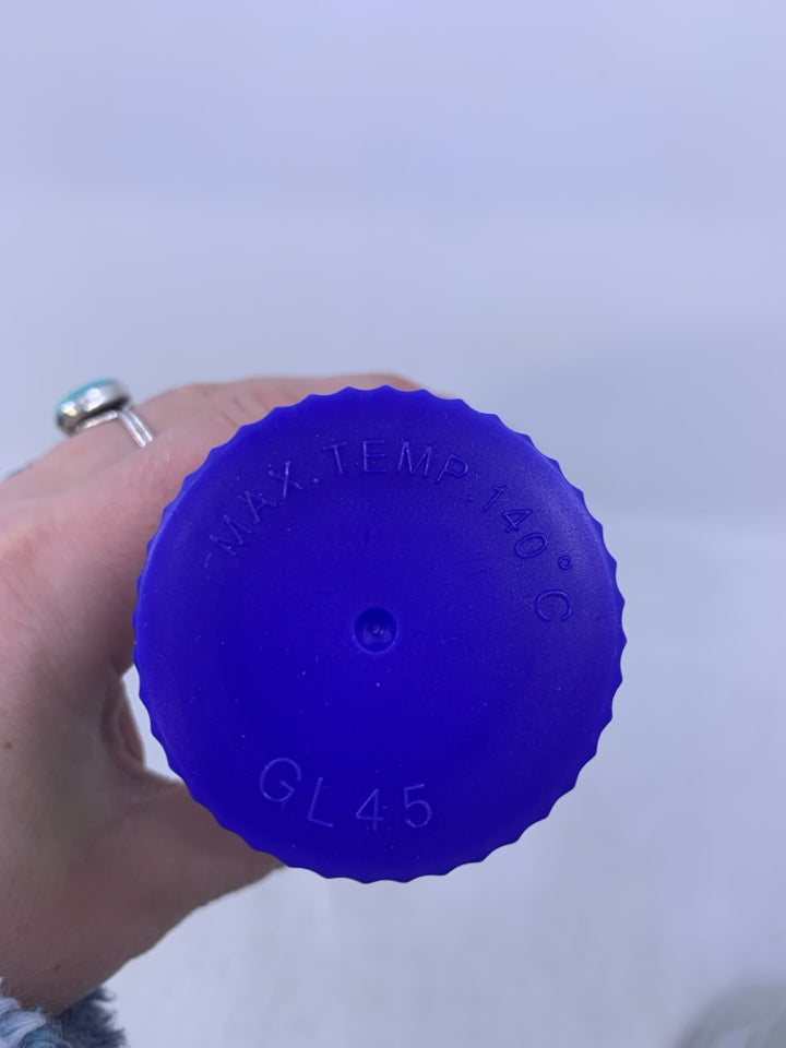 GLASS BEAKER W/ BLUE LID.