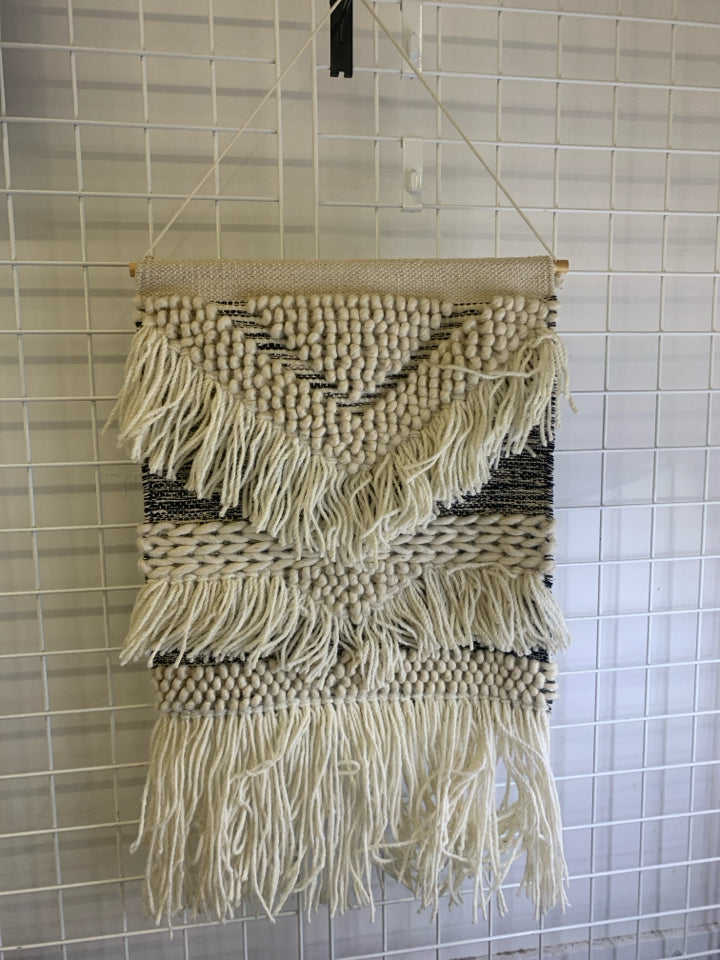 BLACK AND WHITE SHAG WALL HANGING.