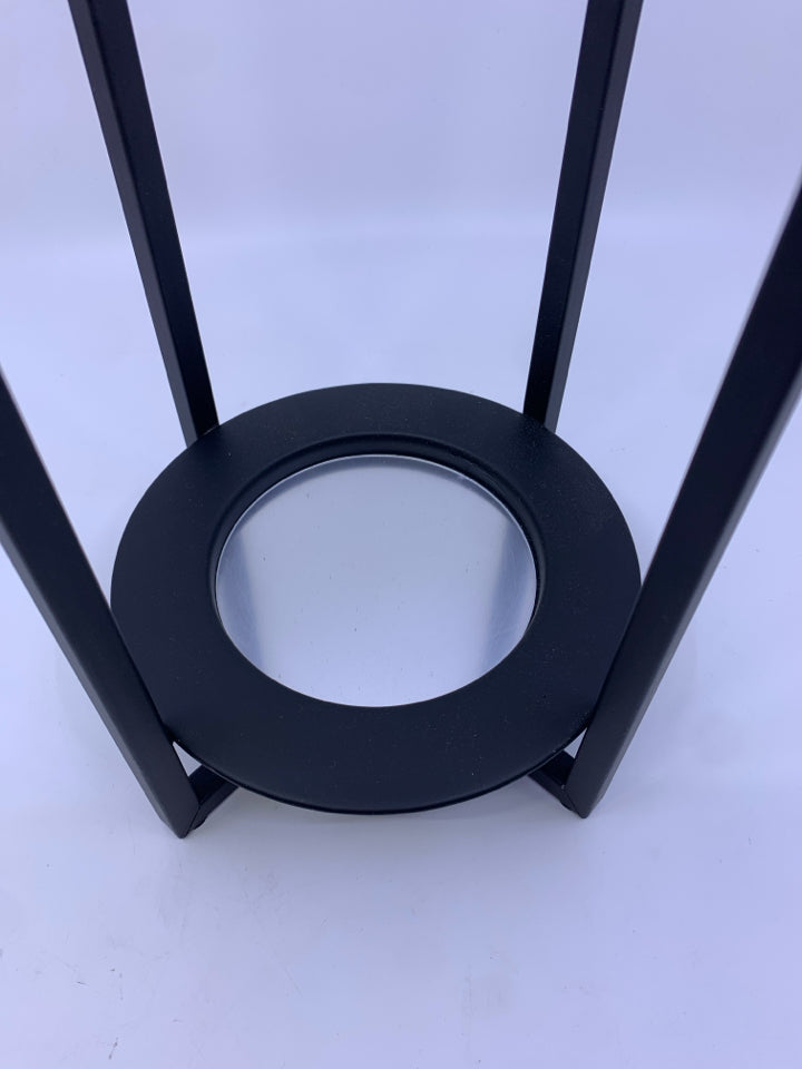 BLACK METAL JAR CANDLE HOLDER.