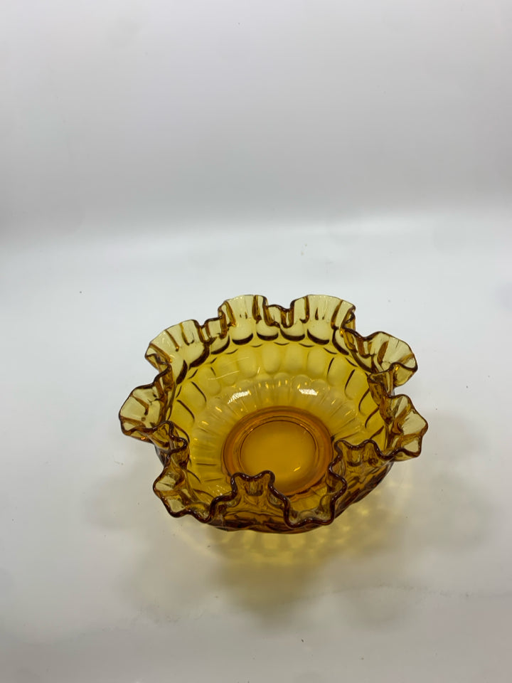 VTG AMBER GLASS THUMBPRINT BOWL W/ RUFFLED EDGE.