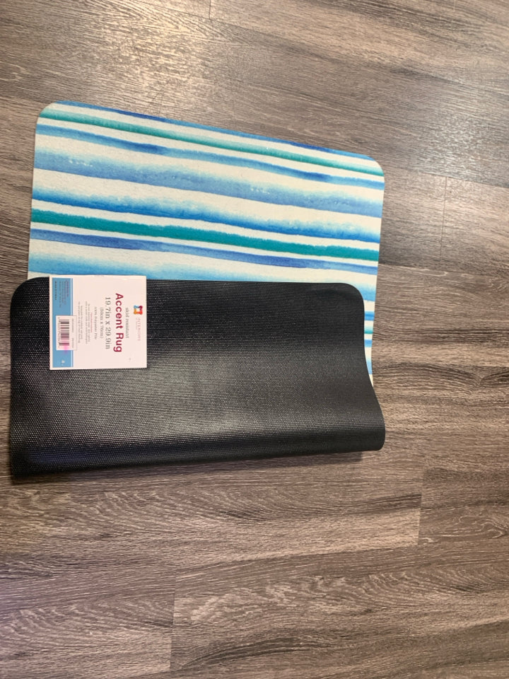 BLUE/GREEN STRIPPED SKID RESISTANT ACCENT RUG.