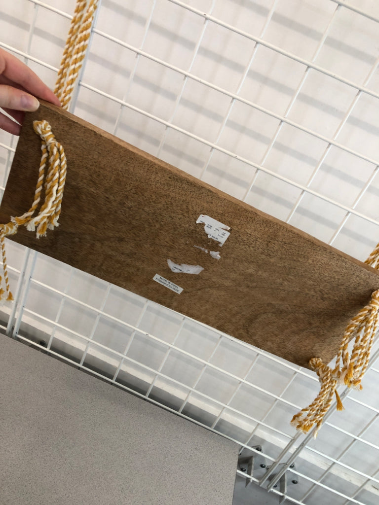NWT HANGING WOOD SHELF W/YELLOW BRAIDED STRING.