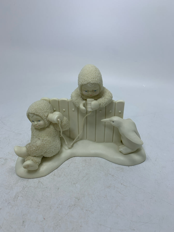 2 BABIES W/ CAN PHONES LEANING ON FENCE SNOWBABIES.