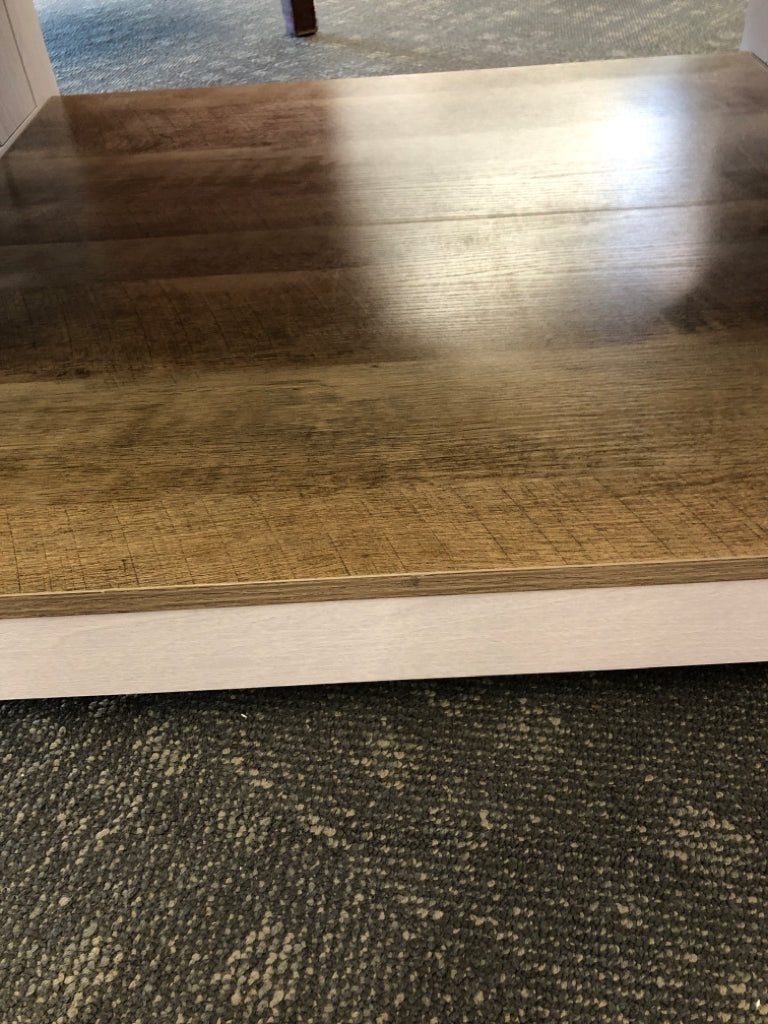 GRAY COFFEE TABLE W/CROSSED DESIGN & WOOD TOP.