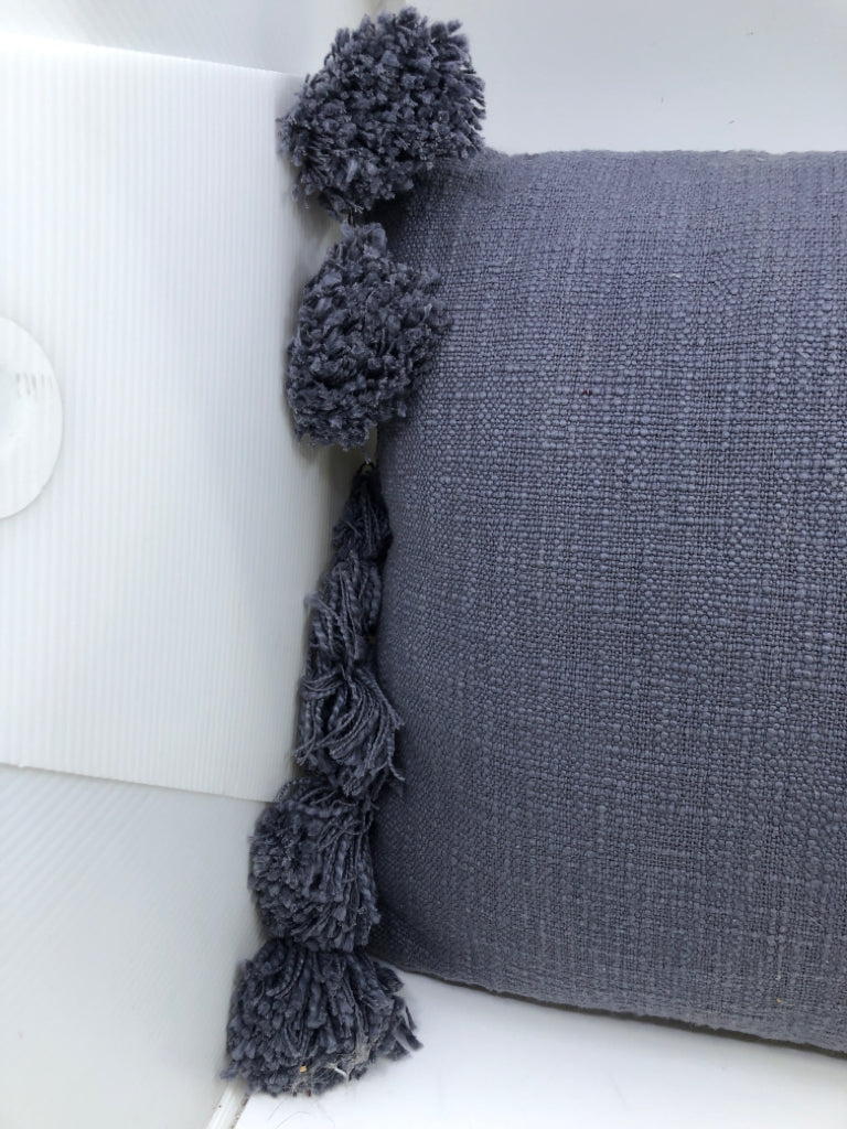 BLUE PILLOW W POM POMS.