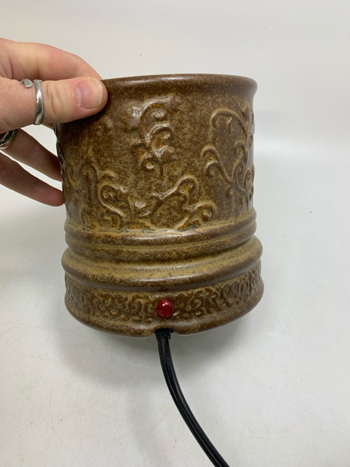 BROWN METAL SCROLL CANDLE WARMER.