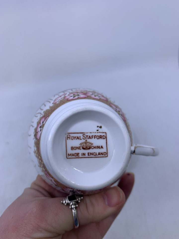 COBALT BLUE/GOLD TEACUP SAUCER W/ PINK FLOWERS.