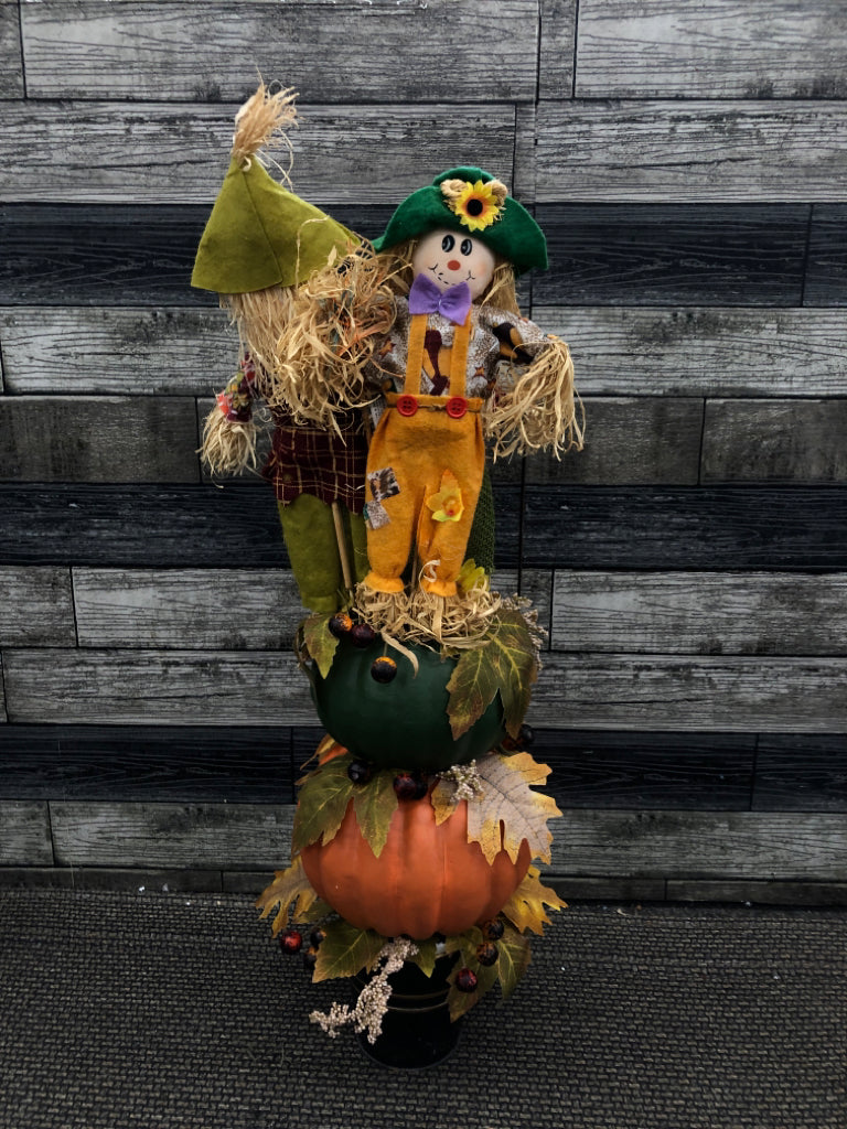 PUMPKIN AND SCARECROW STACK W/LEAVES.
