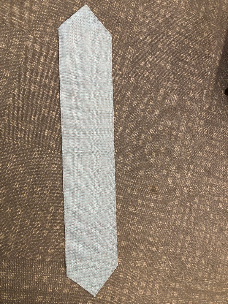 BROWN/TEAL WOVEN TABLE RUNNER.