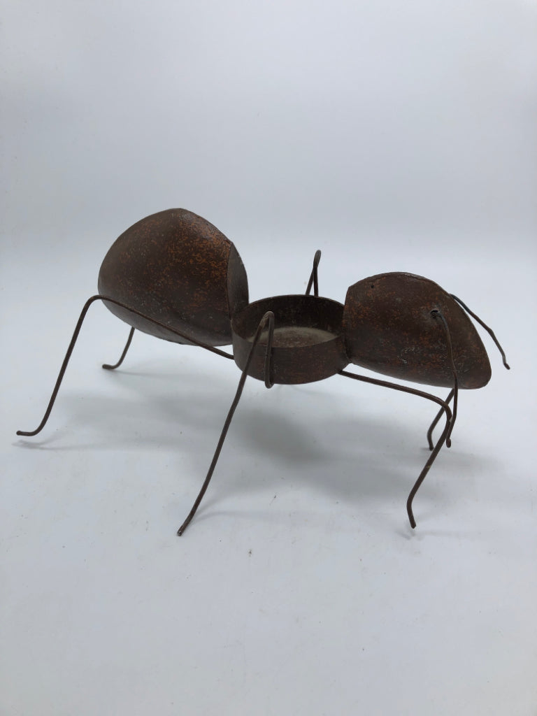 RUSTIC WELDED ANT CANDLE HOLDER.