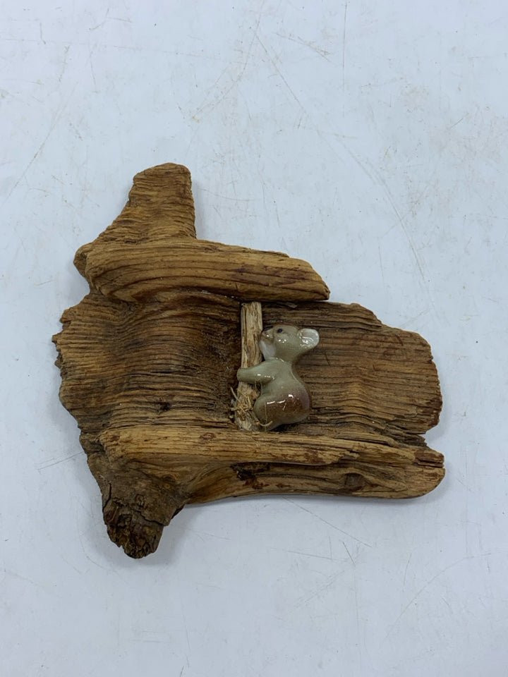 PORCELAIN KOALA ON RECLAIMED WOOD PIECE.