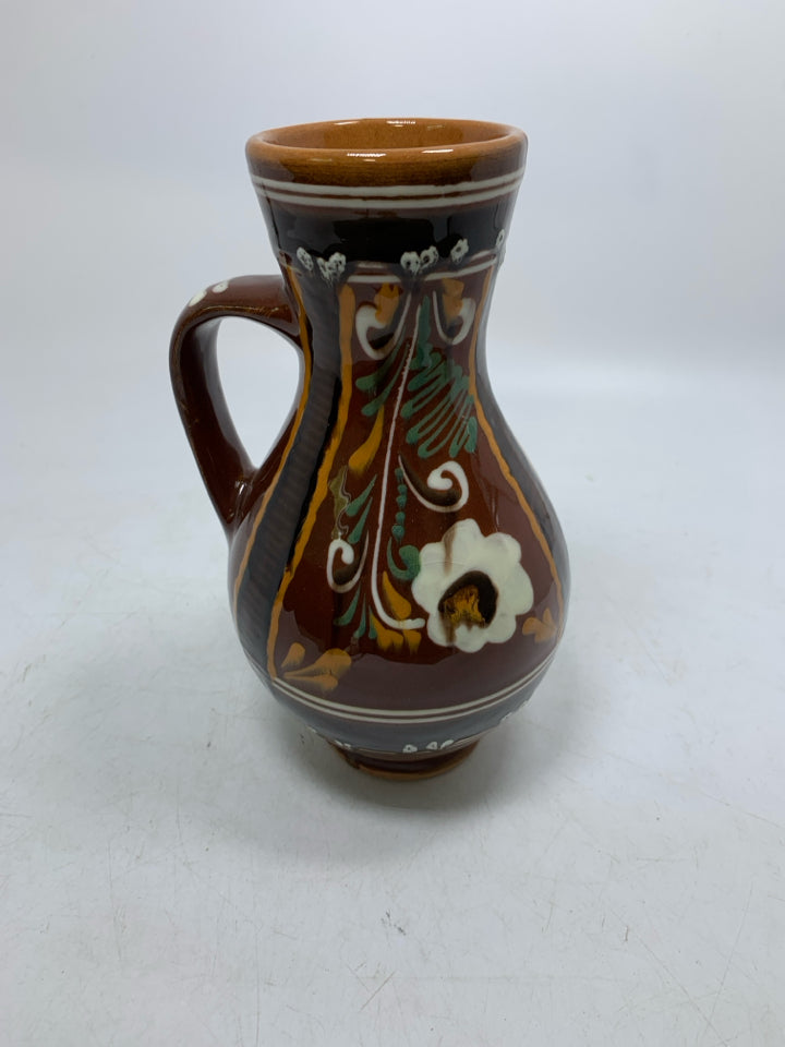DARK BROWN PITCHER W/ DETAILED FLORAL DESIGN TERRA COTTA.