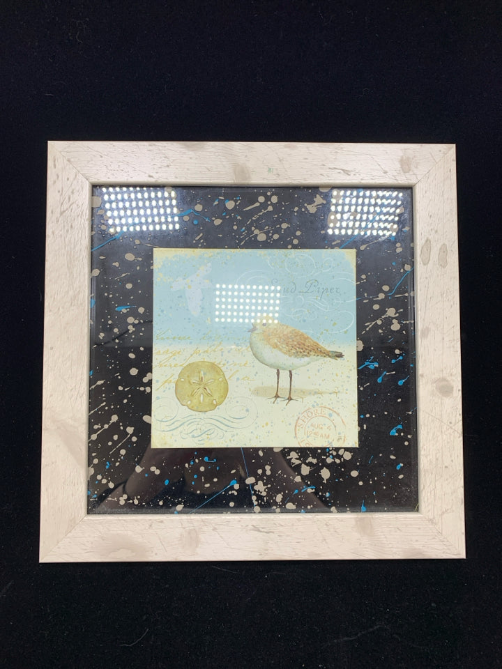 SAND PIPER PRINT IN WHITE WOOD FRAME.