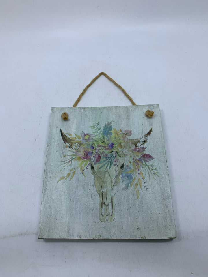 COW SKULL W/ FLORAL HEAD DRESS WALL SIGN.