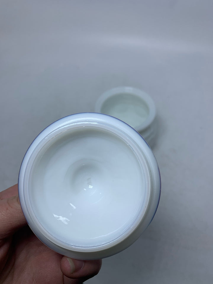 VTG SMALL MILK GLASS CANISTER W/ EAGLE COIN DETAILS.