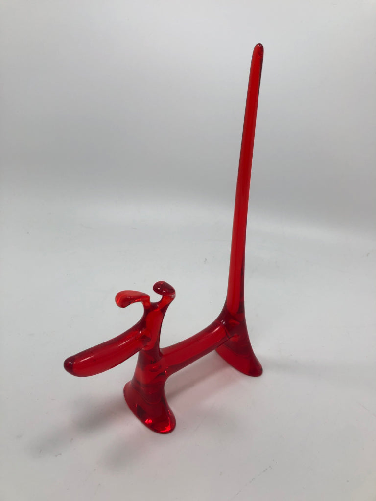 RED RESIN DOG SCULPTURE.