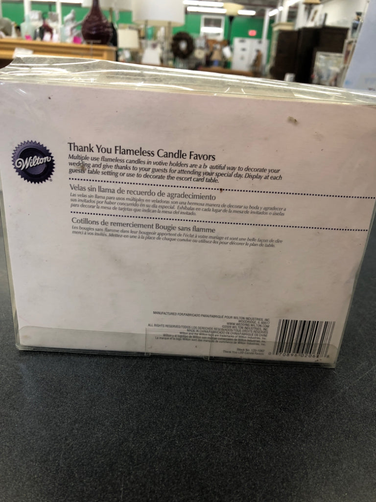 12 NIB FLAMELESS THANK YOU CANDLES.