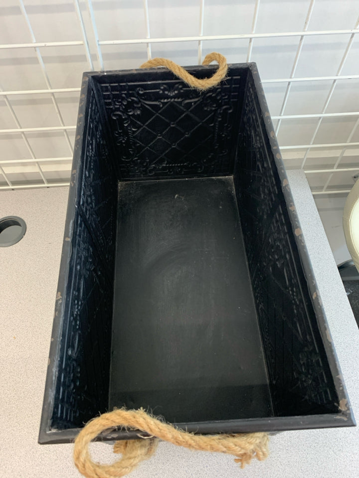 BLACK METAL STORAGE BOX W/TWINE HANDLES.