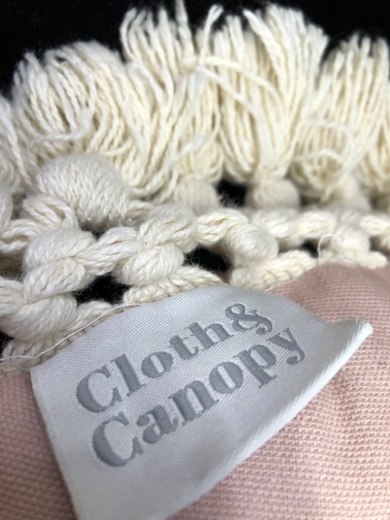 ROUND TAN ACCENT PILLOW W/TASSLE FRINGE.