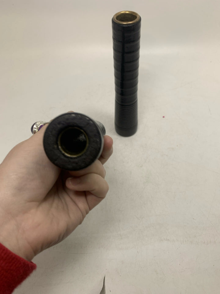 2 BLACK TAPERED CANDLE HOLDERS .