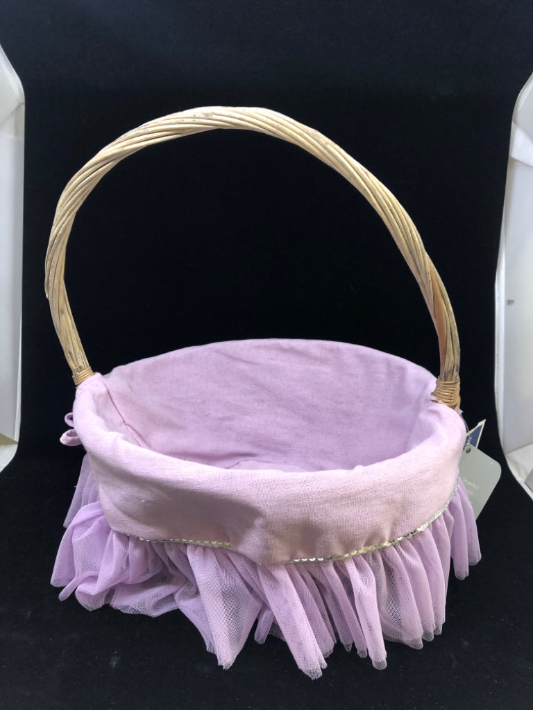 WICKER BASKET W/PURPLE TULLE CLOTH.