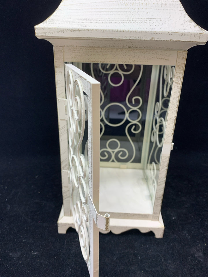 DISTRESSED WHITE LANTERN CANDLE HOLDER W/CURLED WIRE SIDES & CIRCLE HANDLE.