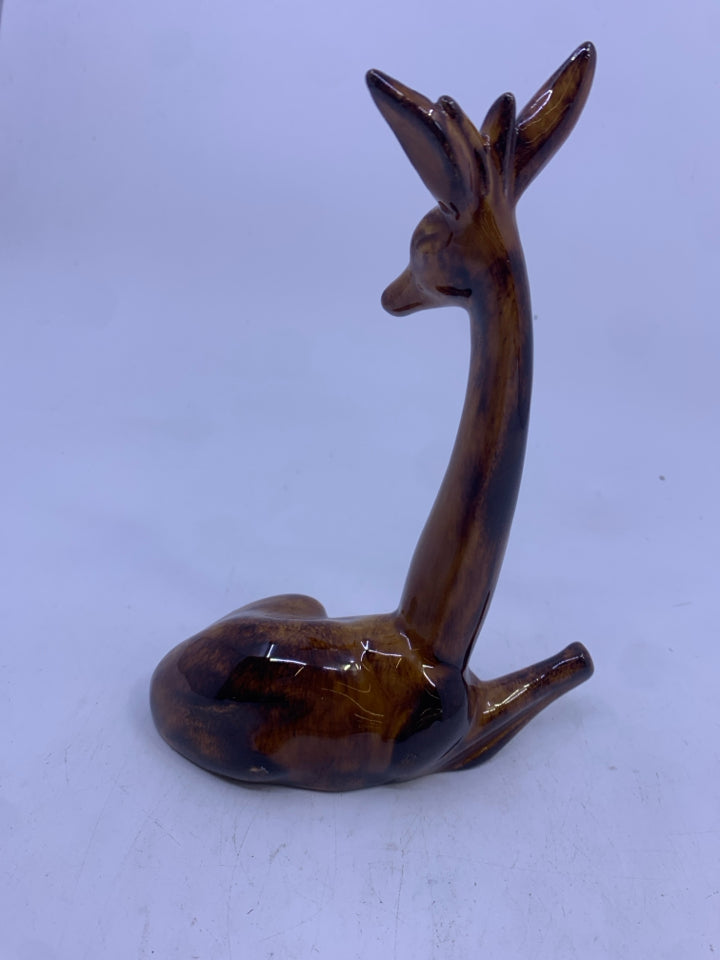 BROWN GIRAFFE LAYING DOWN FIGURE.
