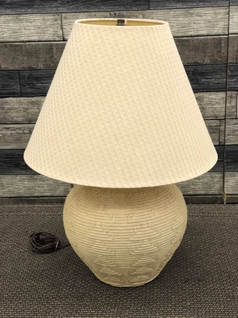 CREAM AZTEC LAMP W TAN SHADE.
