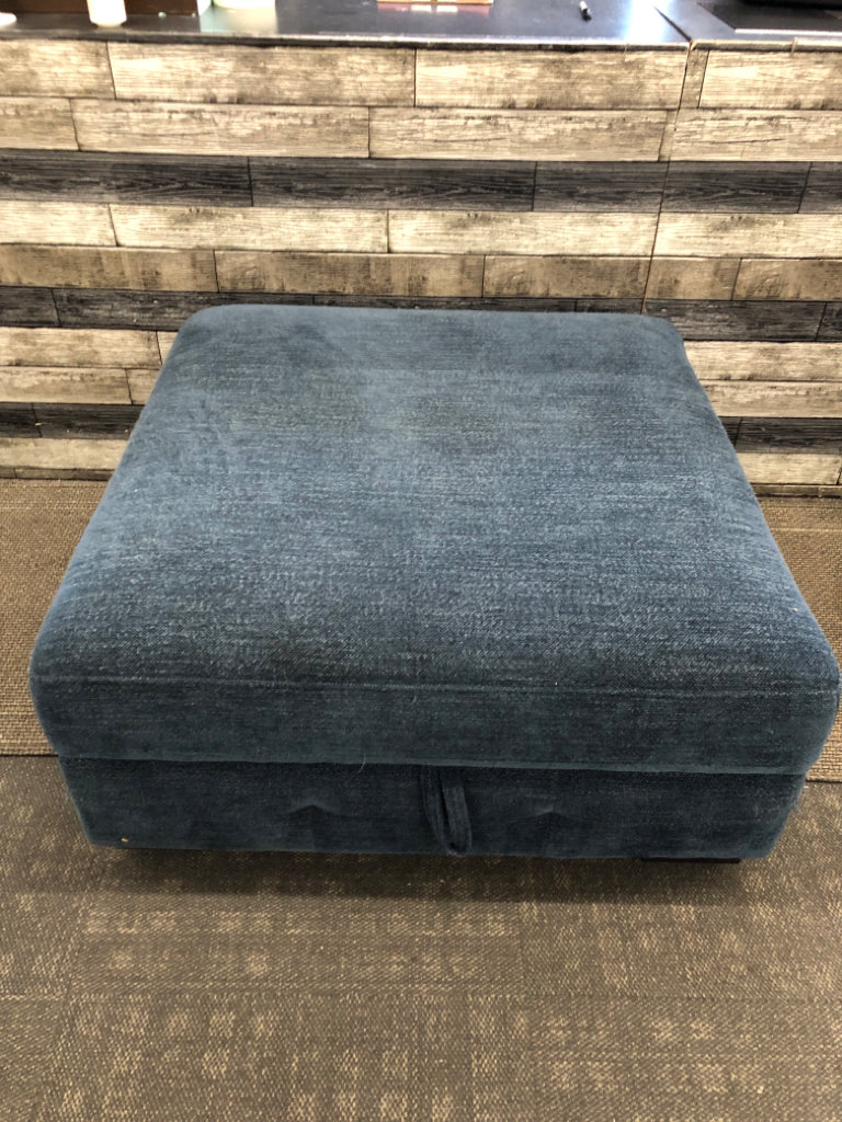 BLUE FABRIC STORAGE OTTOMAN.