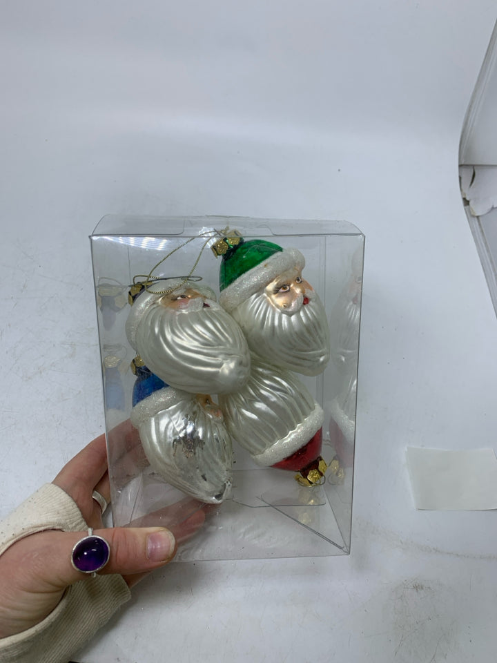 IN BOX 4 GLASS SANTA HEADS ORNAMENTS.