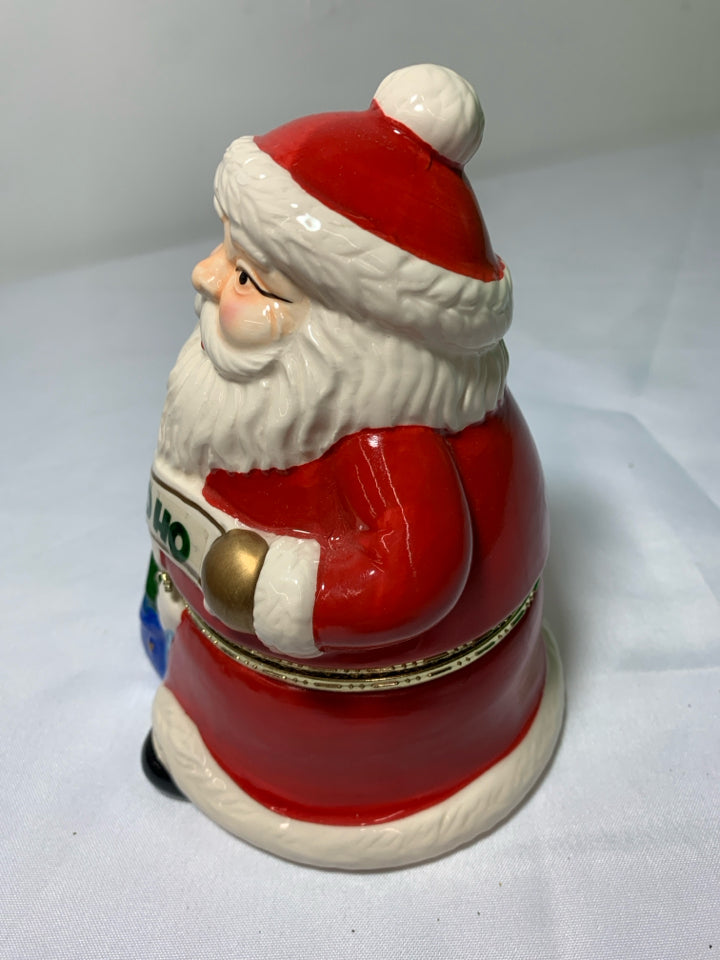 CERAMIC SANTA MUSIC BOX W/ REINDEER PULLING SLAY INSIDE.