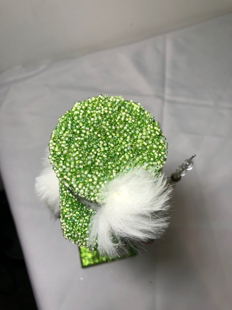 GREEN AND WHITE GLITTER NUT CRACKER.