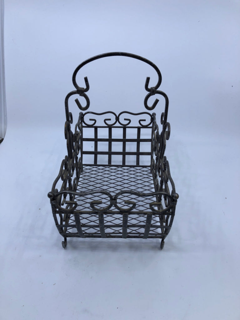 FOOTED METAL SCROLL BASKET W/ HANDLE.