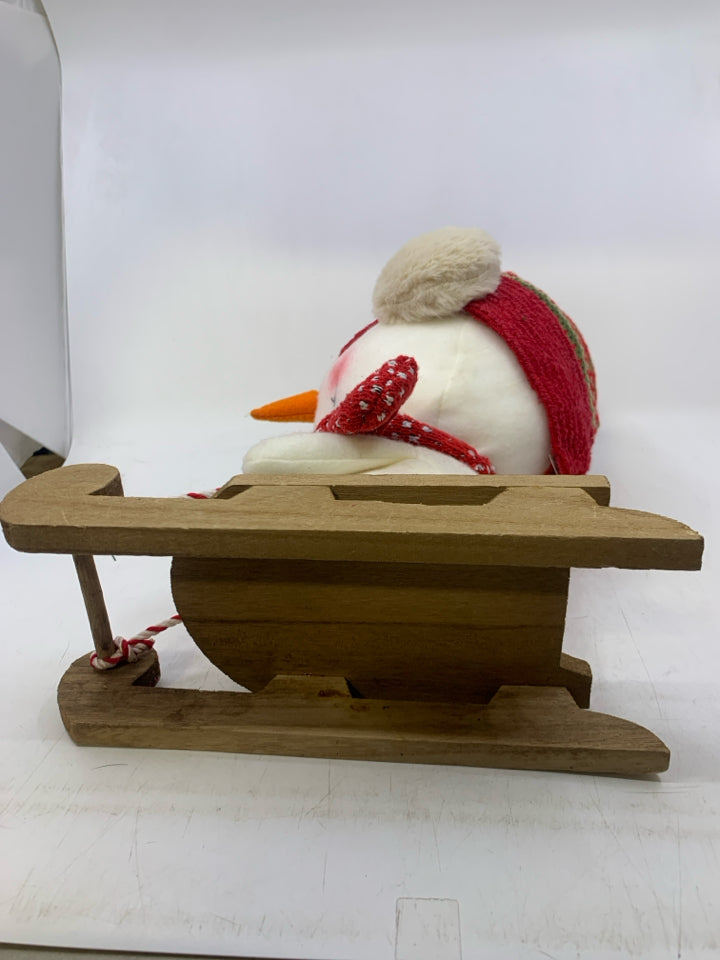 LARGE PLUSH SNOWMAN ON SLED.