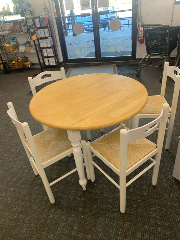 ROUND WHITE DINETTE BLONDE WOOD TOP W/ FOLDING SIDES AND 4 WHITE WICKER BOTTOM C