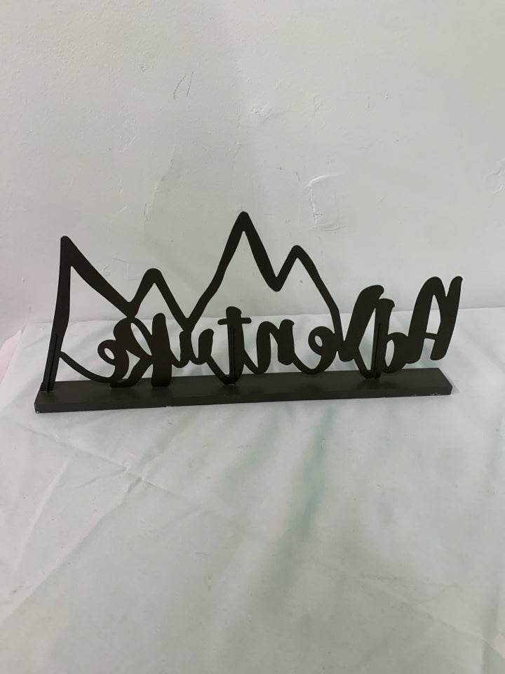 BROWN METAL STANDING ADVENTURE SIGN.