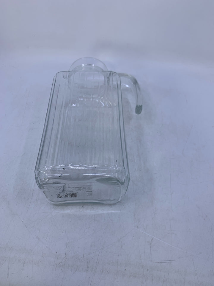 CLEAR GLASS RIBBED PITCHER.