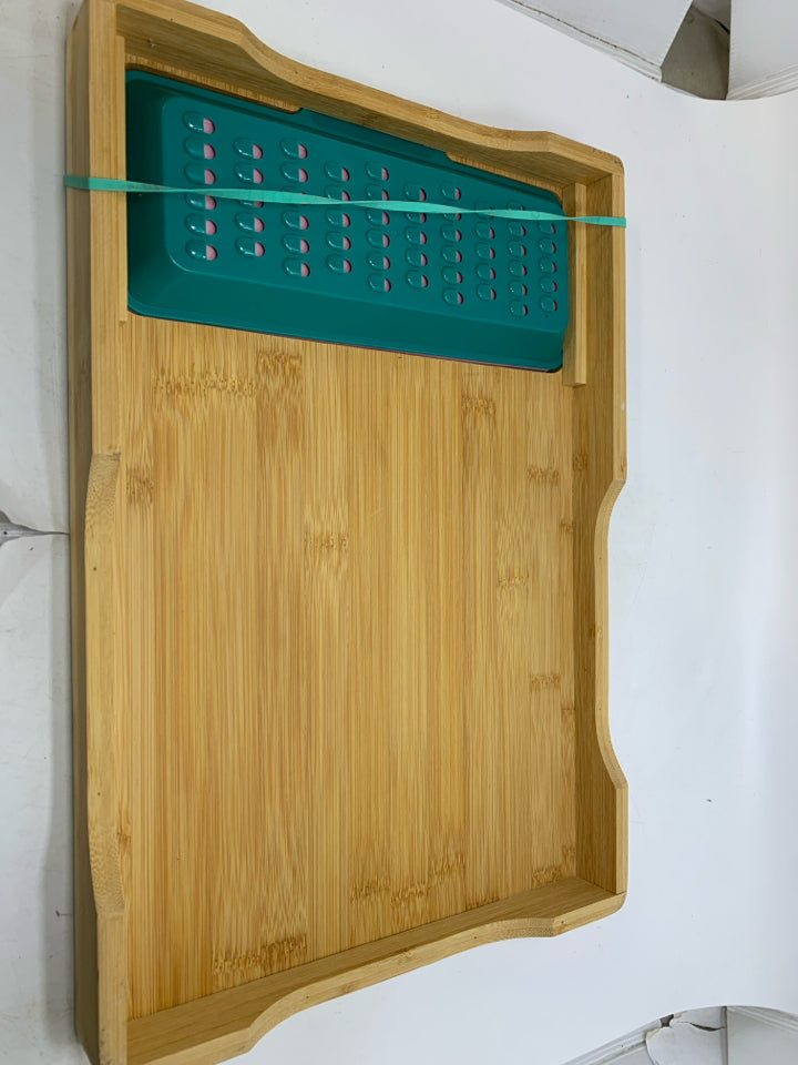 WOOD CUTTING BOARD W/ PLASTIC INSERTS.