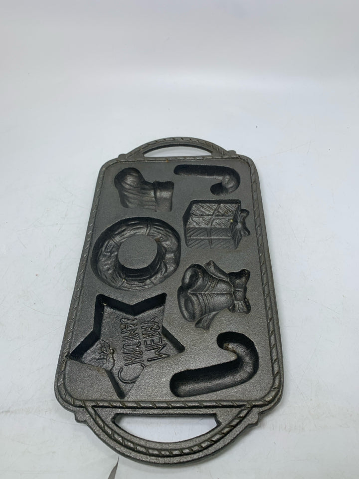 VTG 7 SLOT ASSORTED HOLIDAY THEME CAST IRON BAKING PAN.