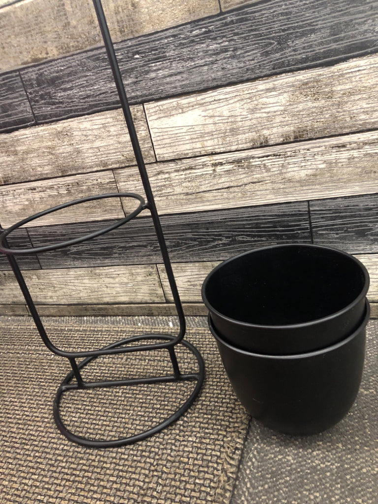 MINIMALIST BLACK METAL TIERED PLANT STAND.