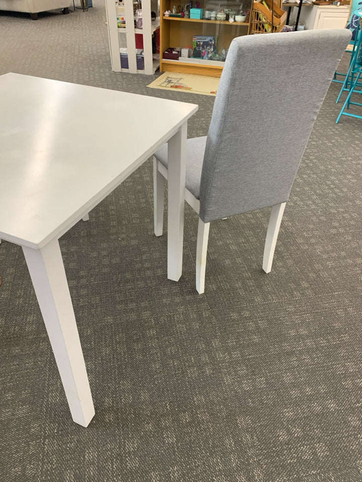 WHITE TABLE W/2 GRAY UPHOLSTERED CHAIRS.