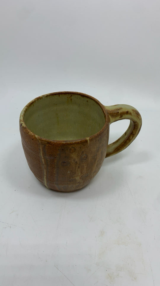 TAN POTTERY MUG.