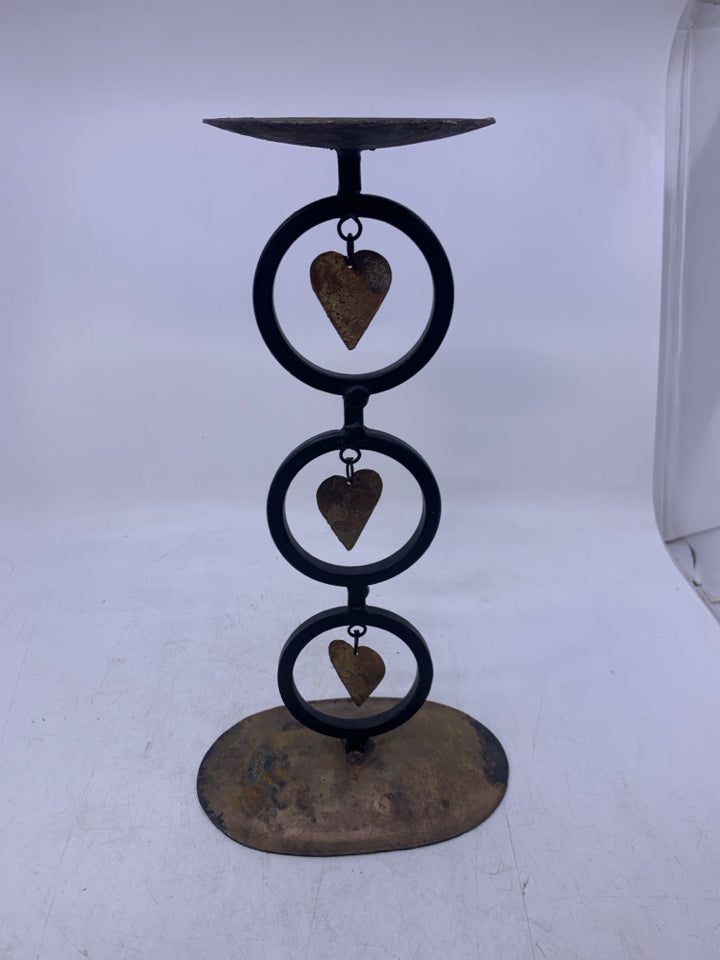 METAL RUSTIC PILLAR CANDLE HOLDER W/ HEARTS/CIRCLES.