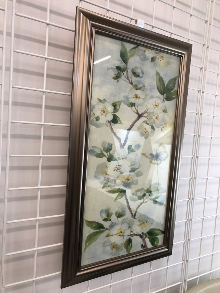 BLUE FLORALS IN SILVER FRAME.