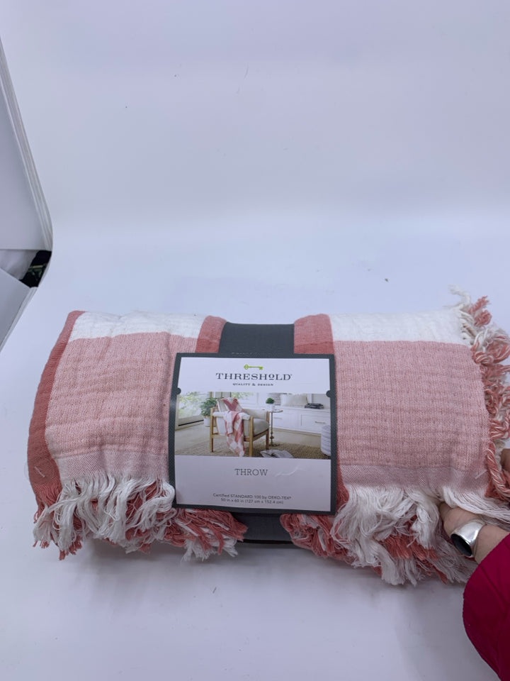 NIP LIGHT PINK THROW BLANKET.