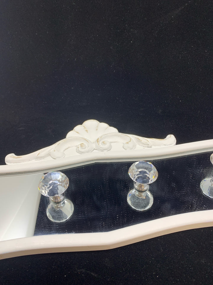 MIRRORED WALL HOOKS.