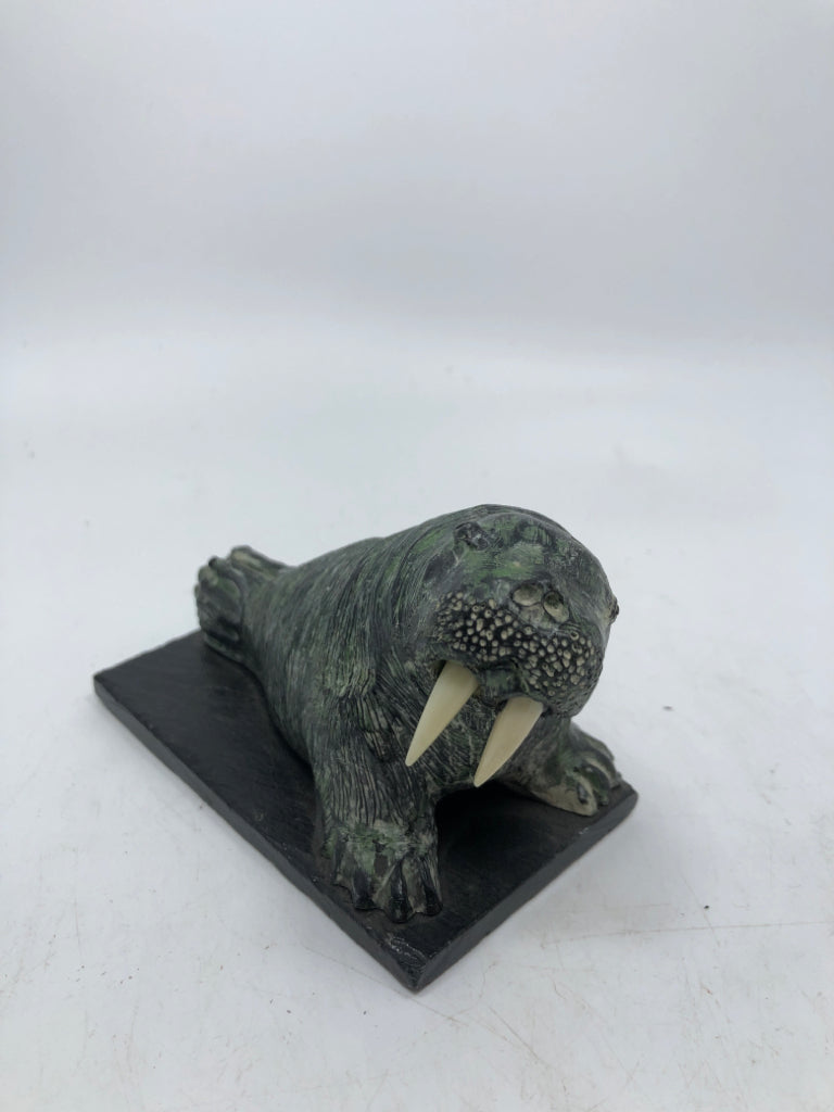 VTG STONE CARVED WALRUS W/WHITE TUSKS.