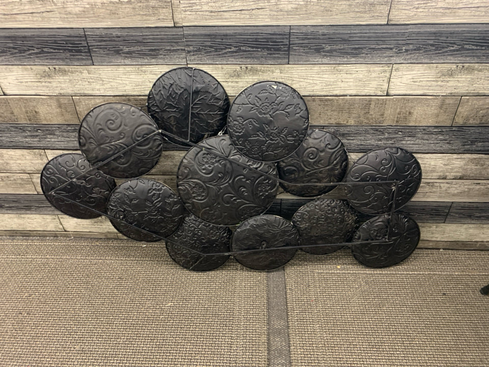 DARK BROWN CIRCLE PATTERN WALL HANGING.